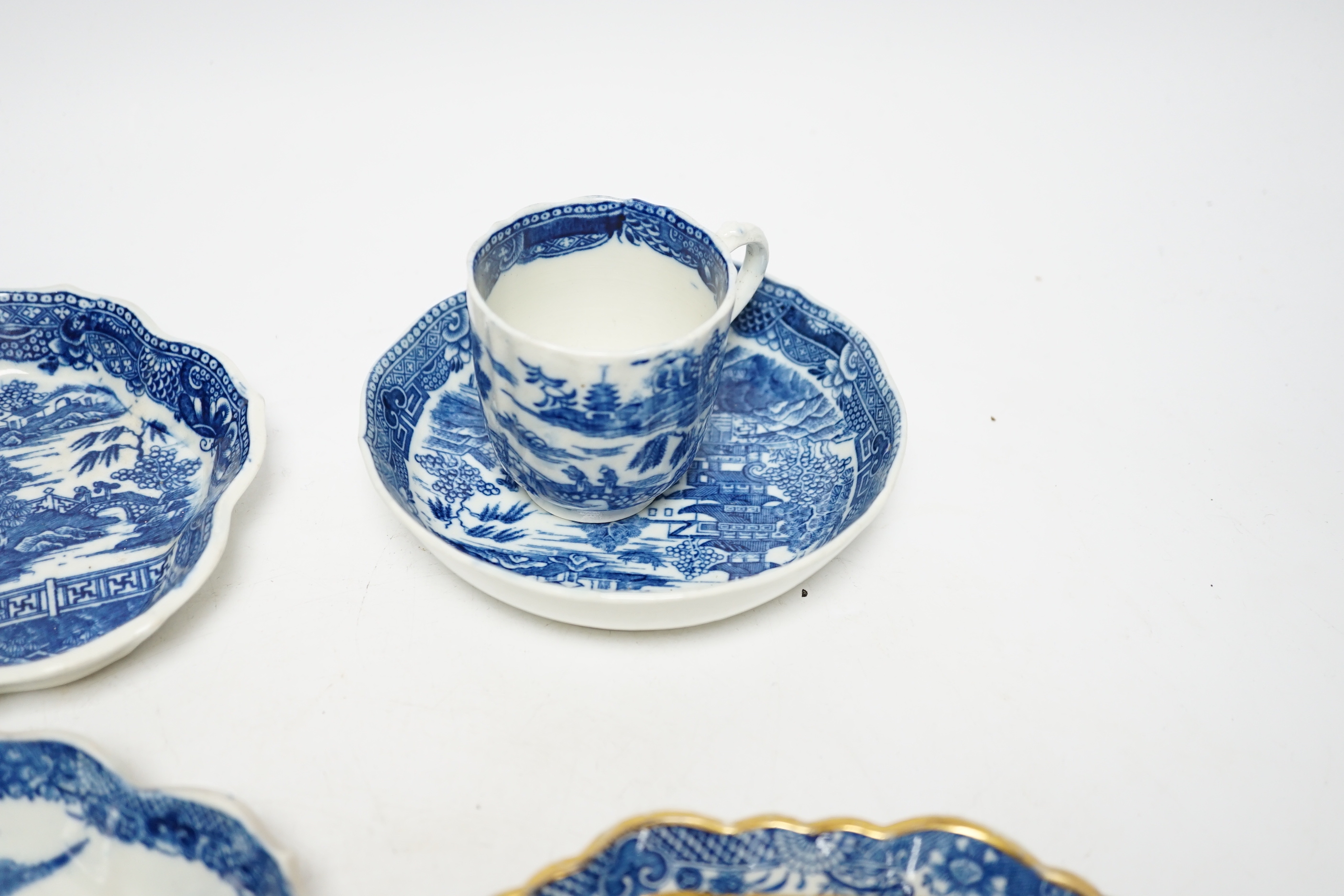 A group of Caughley pagoda pattern table wares, late 18th century, including two teapot stands, a coffee cup and saucer and a spoon tray